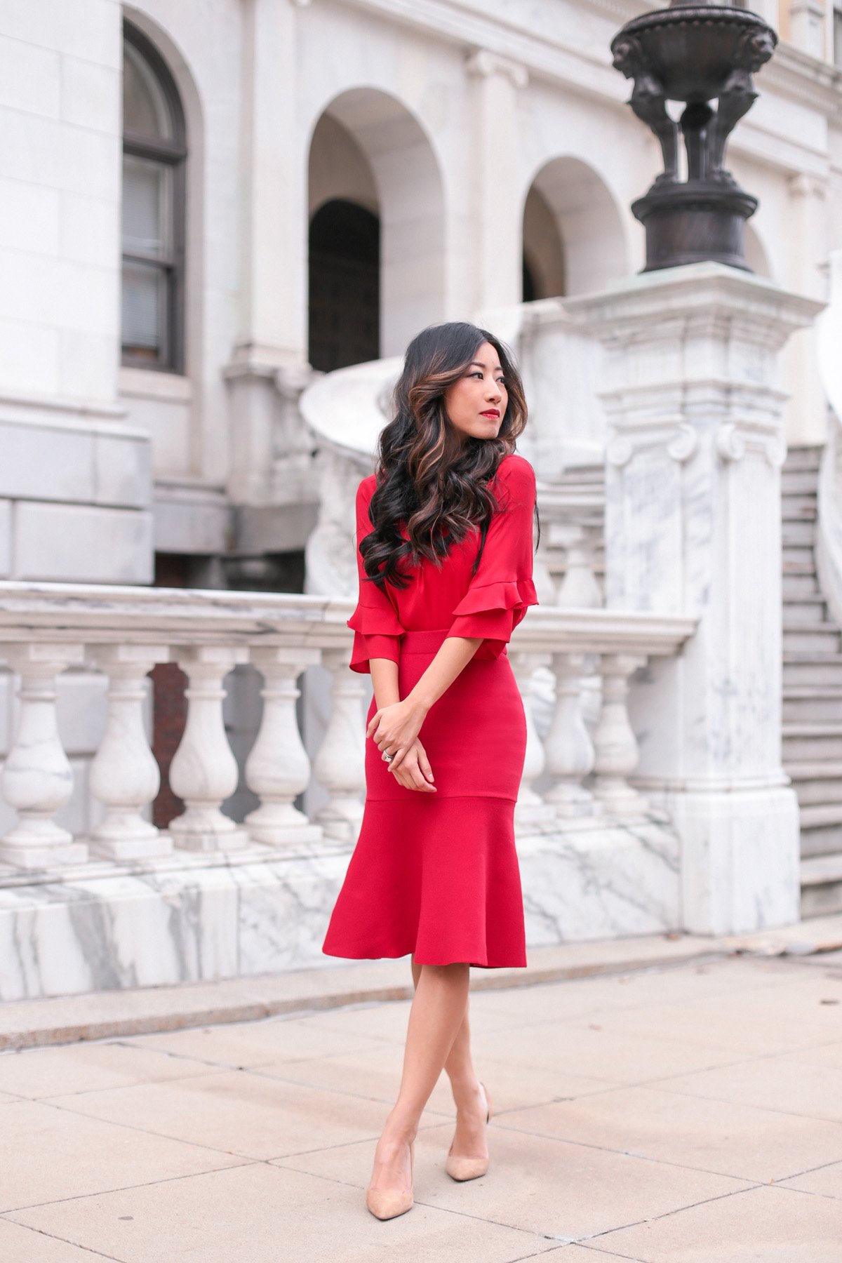 lady in red holiday outfit petite fashion blog
